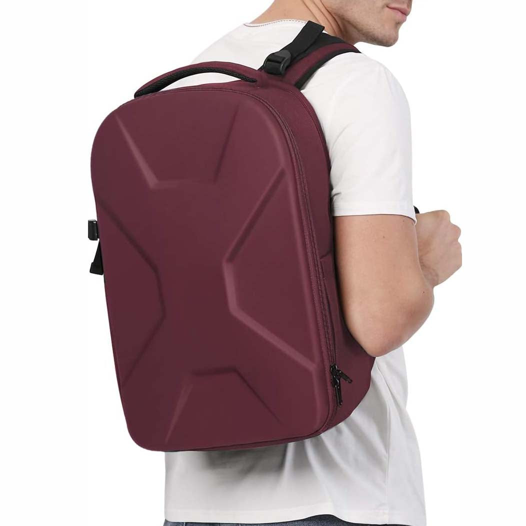 Camera backpack, waterproof hard shell for DSLR/mirrorless cameras, with tripod straps and compartments.